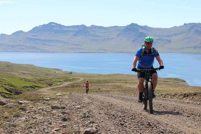 A handsome fella biking up the hillside on the way to Vöðlavík. 